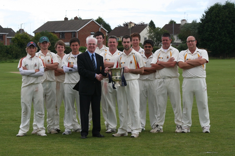 NCU President Dr Murray Power with Lurgan captain Steven Chambers and the Lurgan team who played Downpatrick